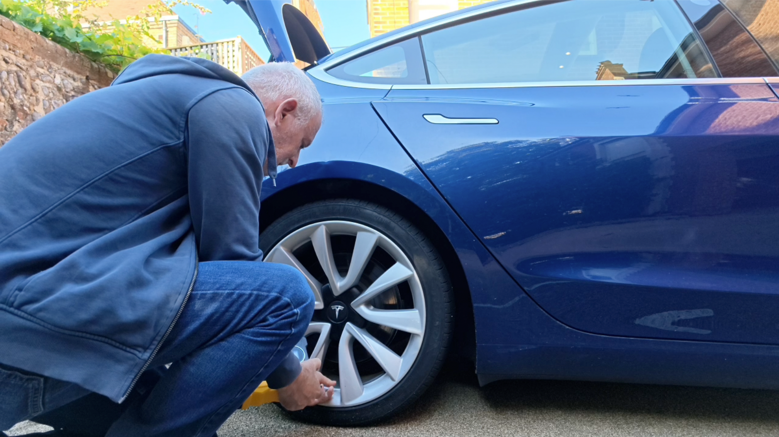 Rob checking a tyre before leaving the car unused during long term travel